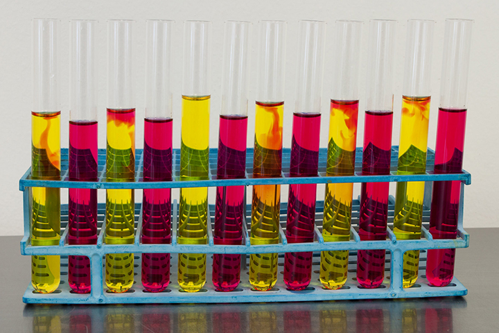 test tubes with red and yellow liquids