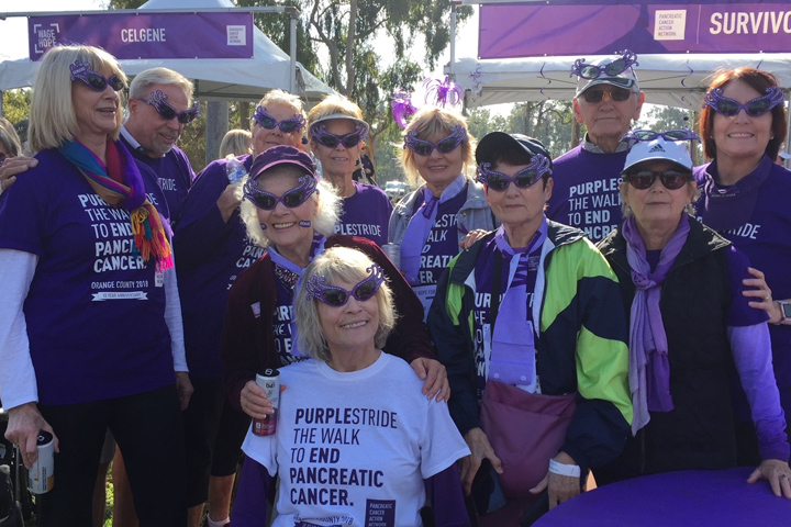 Pancreatic cancer survivor Carolynn Kiel in purple sunglasses at a PanCAN Purple Stride event