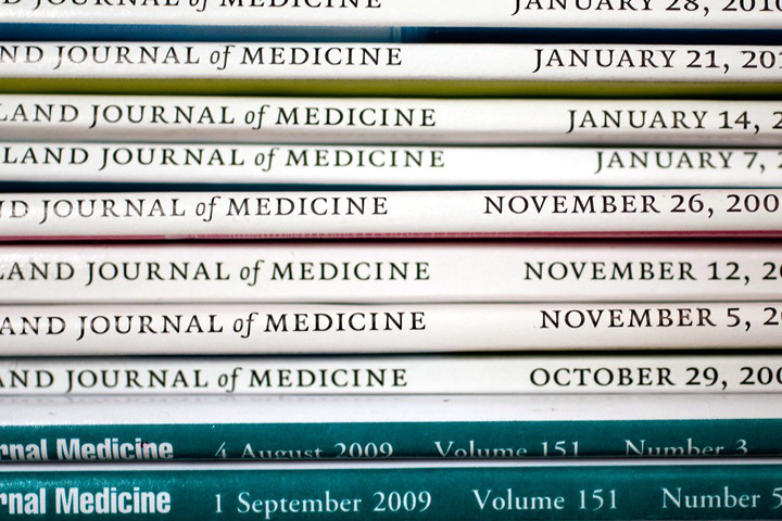 Stack of medical journals laying on their sides