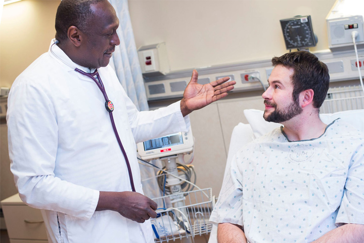 Doctor talking to a patient in a hospital bed