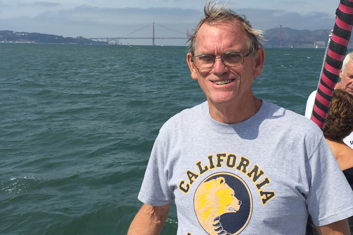 Pancreatic cancer survivor Ed Duncan on the water of San Francisco bay, with the Golden Gate Bridge in the background