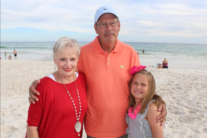 Kayi Lewis, her husband Ron Lewis, and granddaughter at the beach