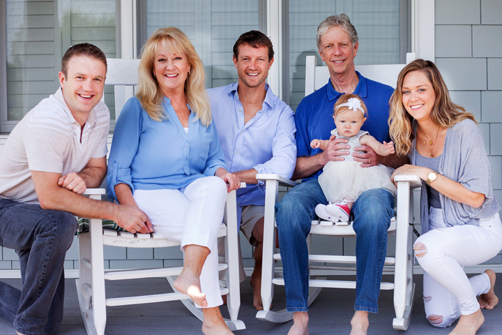 Pancreatic cancer patient Rob Babcock, holding his granddaughter, and surrounded by his family