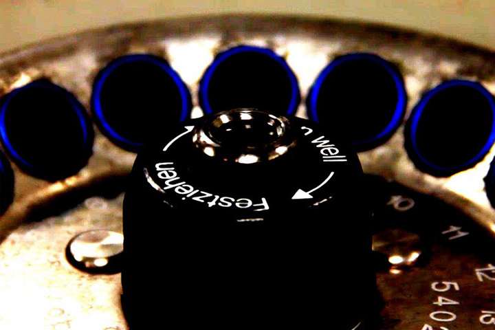 Close-up image of the top of a centrifuge, over the central axis
