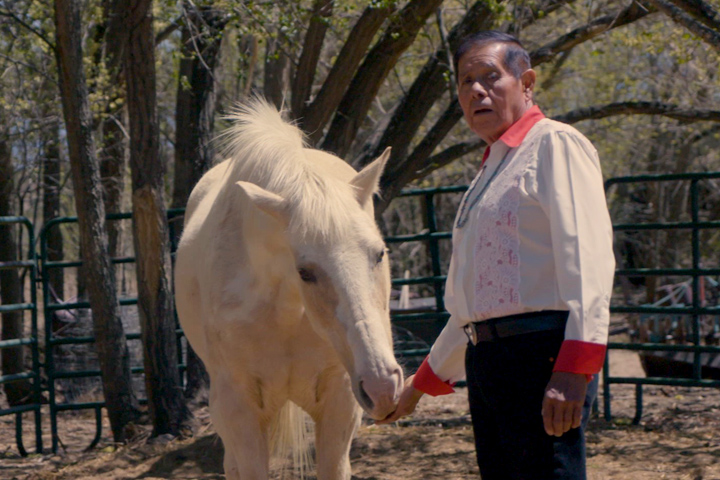 long-term pancreatic cancer survivor Jose Lucero and his white horse