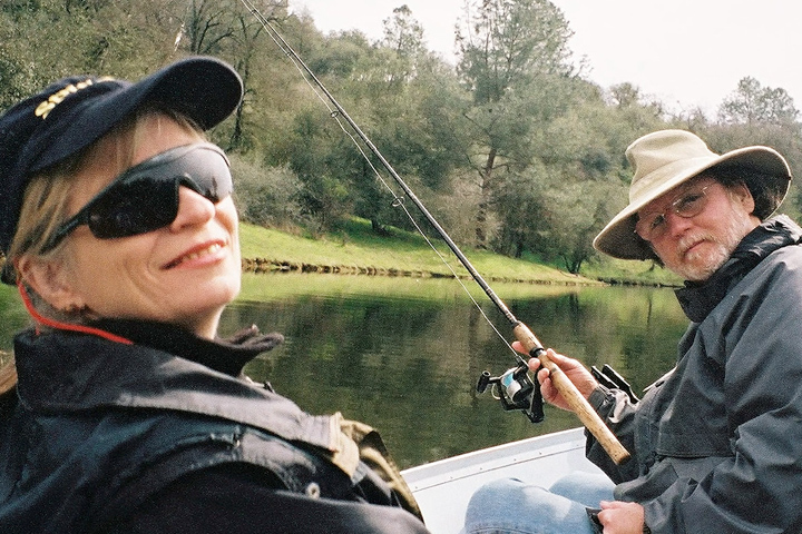 Lee Ringuette and his wife in a boat fishing on a lake