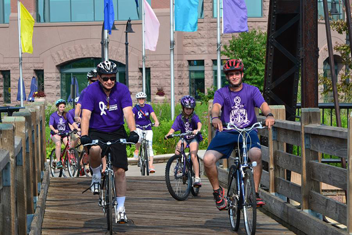Tommy Thompson on his bicycle at Purple Stride