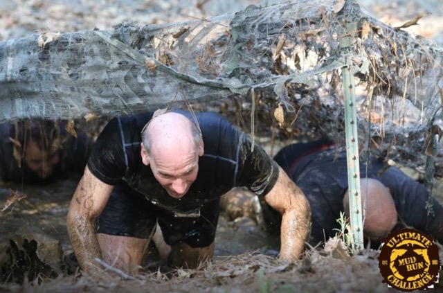 Jon Levin in a mud run