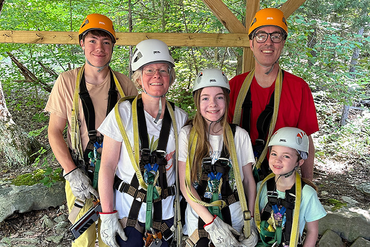 Long-term survivor Malcolm Robertson and his family at a zipline.