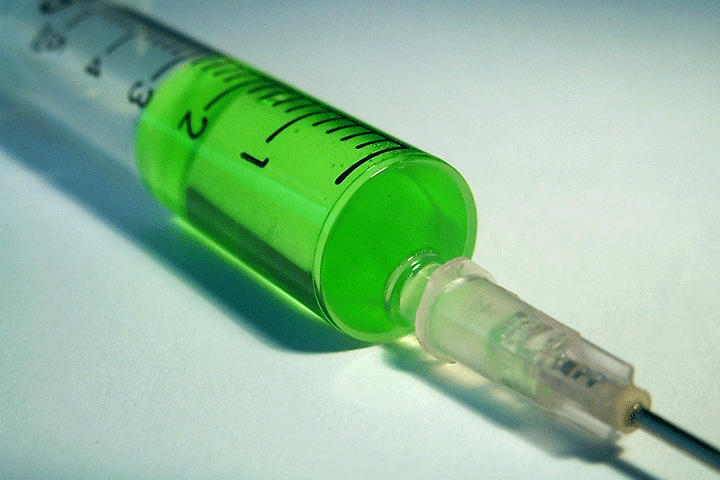 syringe with green liquid