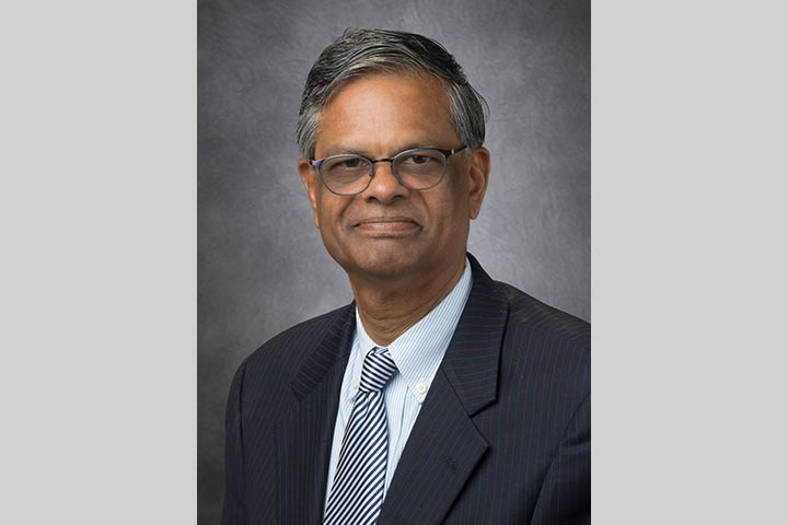 Pancreatic cancer and diabetes researcher Dr. Suresh Chari, in a dark suit, white shirt and tie.